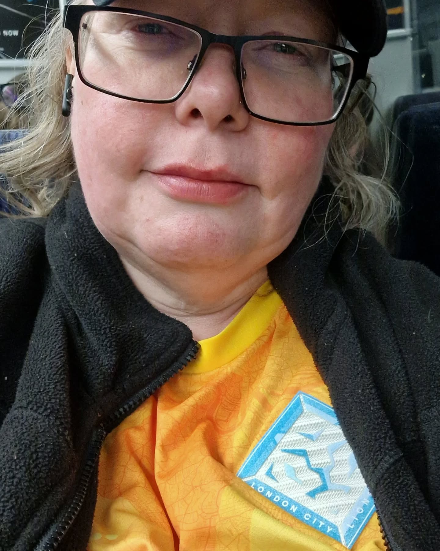 A very tired Nessy on the train home from Birmingham following London City's promotion to the WSL